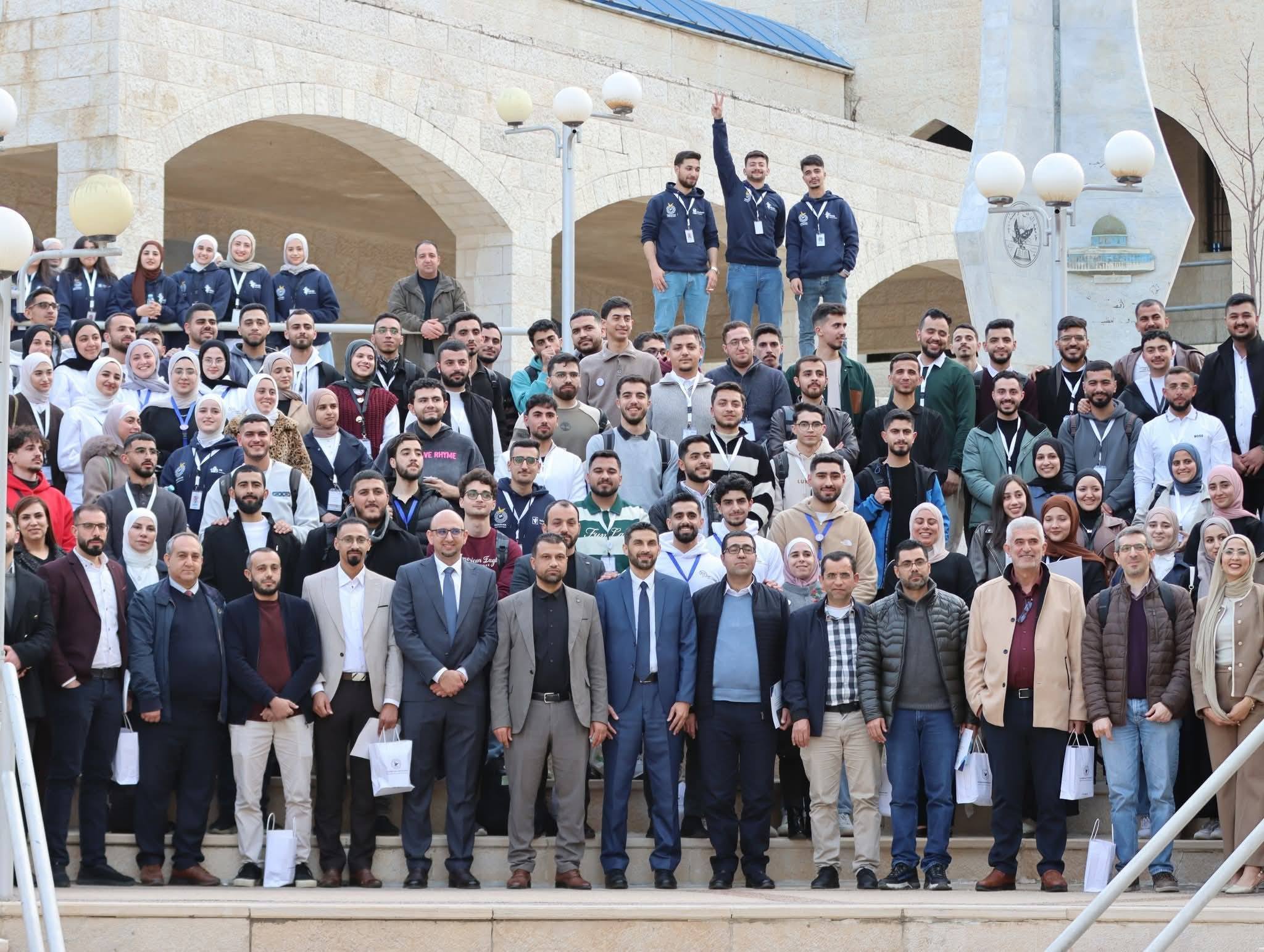 Participants and organizers gather for a group photograph at the fourth Palestinian Quantum Computing and AI Hackathon.